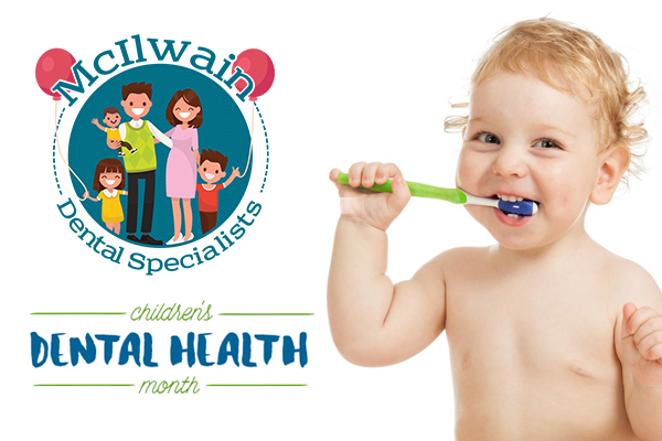 Baby holding a toothbrush next to a logo of McIlwain Dental Specialists.