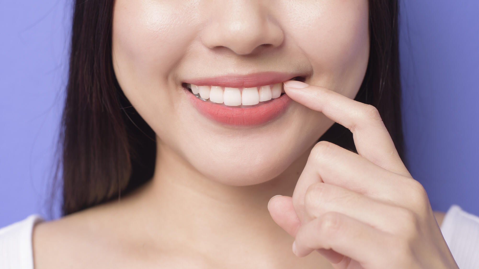 Woman smiling with straight white teeth