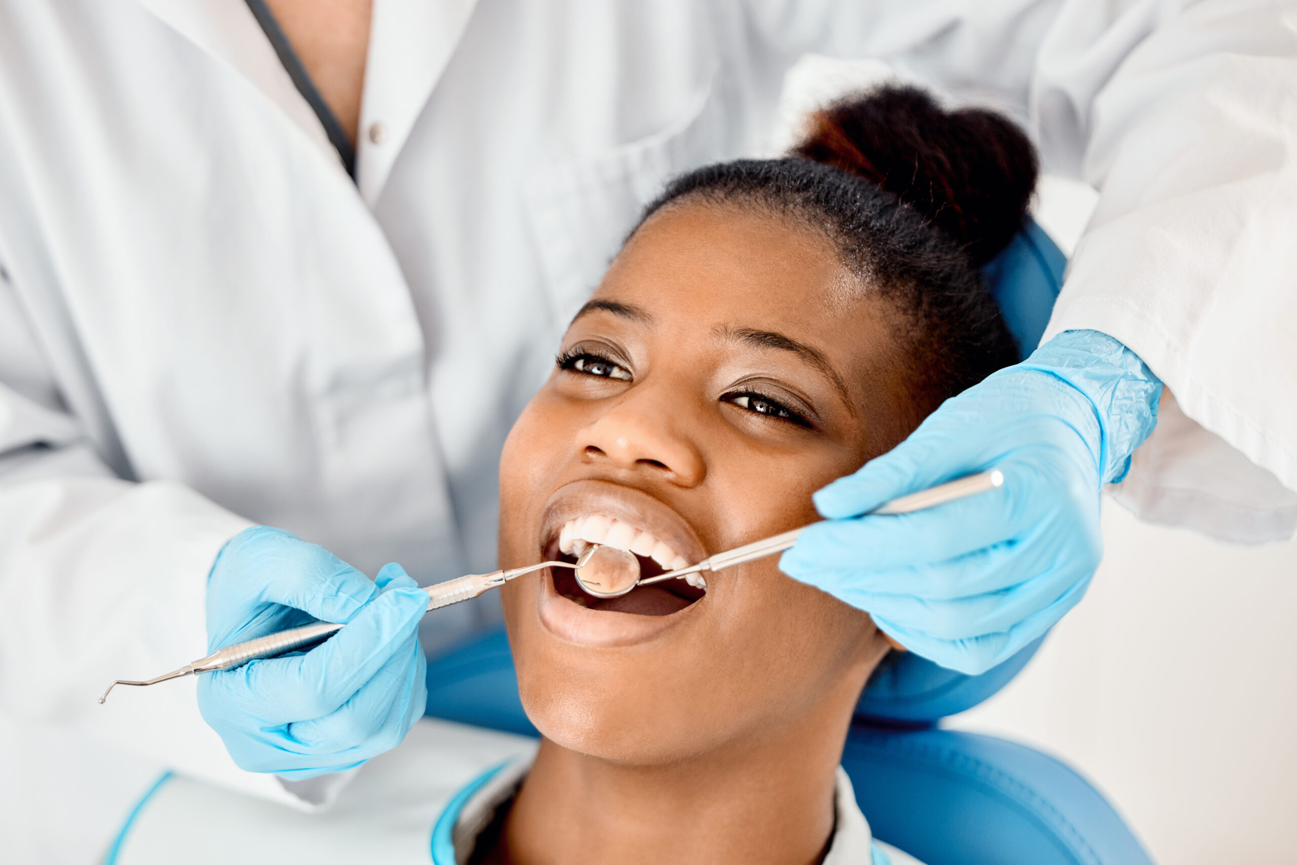 Women in dental chair getting a dental exam